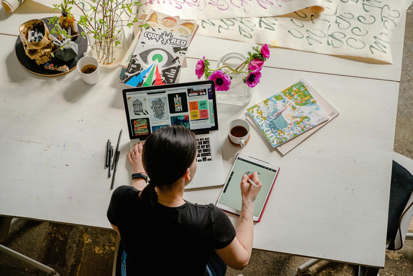 Woman working on laptop and tablet